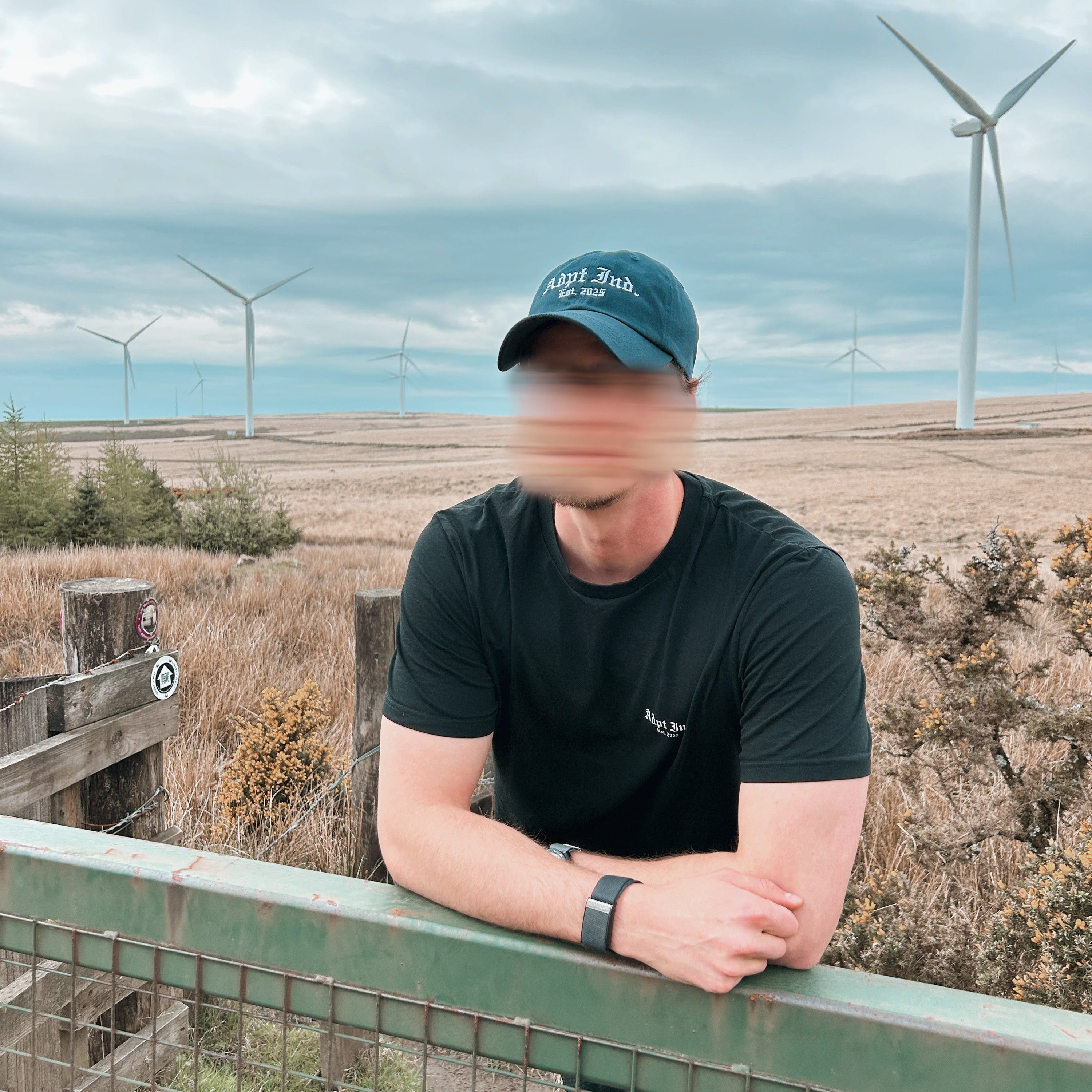 Model wearing baseball Hat, Navy, Embroidered logo, front view