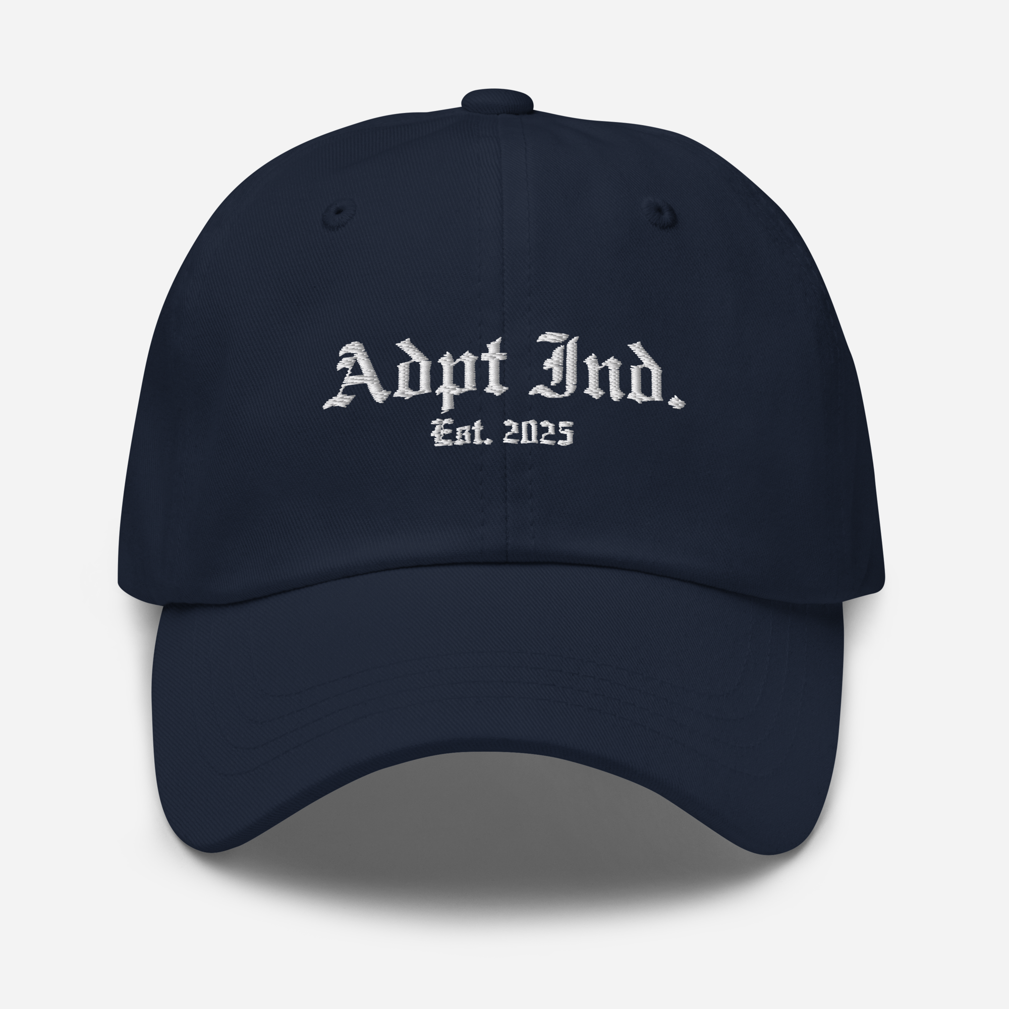 Front view of navy dad hat, embroidery on front
